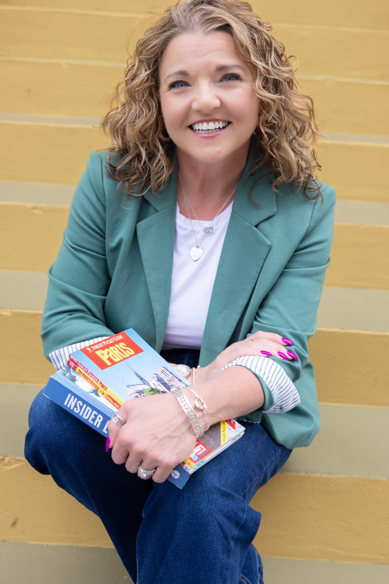 Tiffany Watt sitting on Charleston steps with European guidebooks