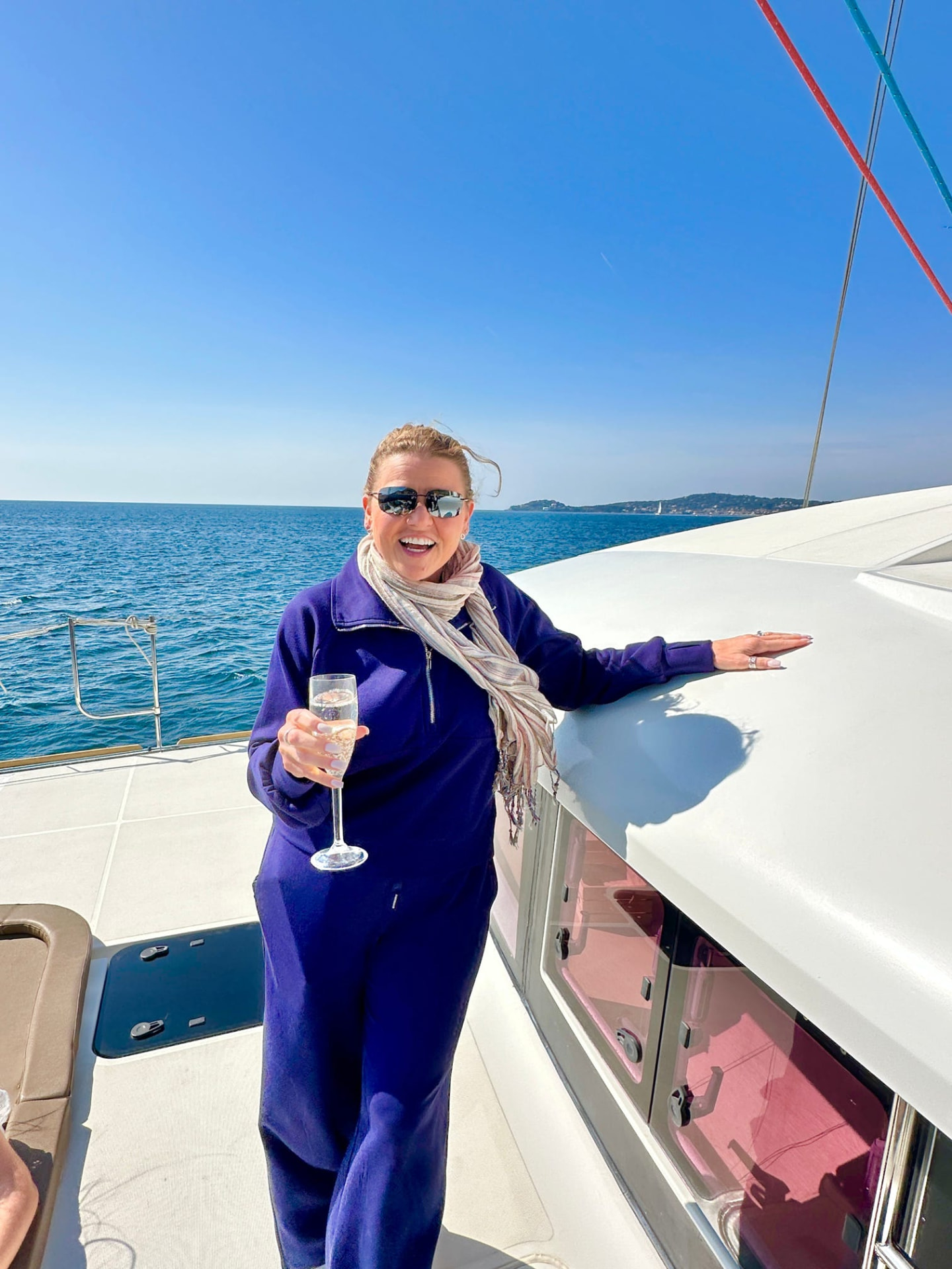 Tiffany Watt with a glass of champagne aboard a catamaran off the French Riviera
