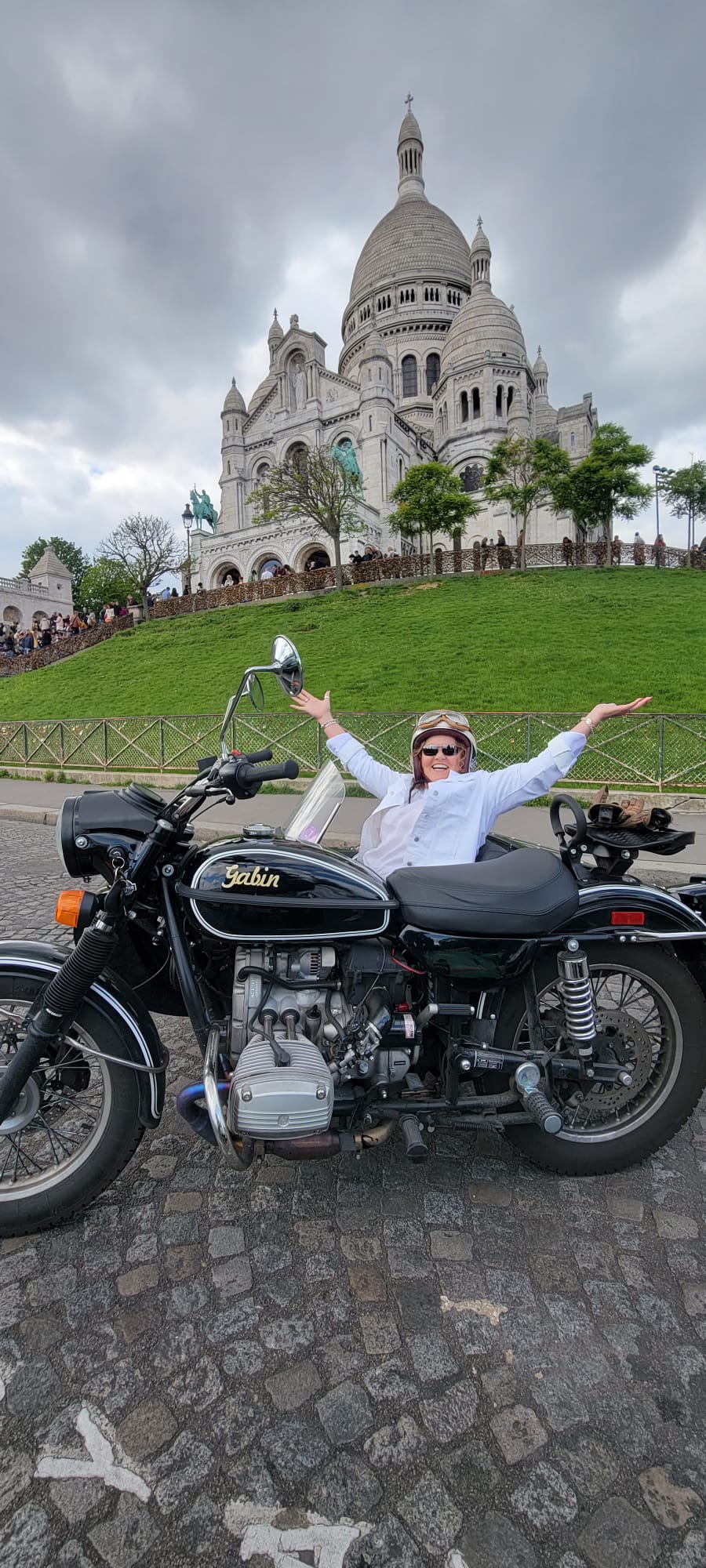 Tiffany Watt on a vintage motorcycle in front of Sacré-Cœur in Paris, France